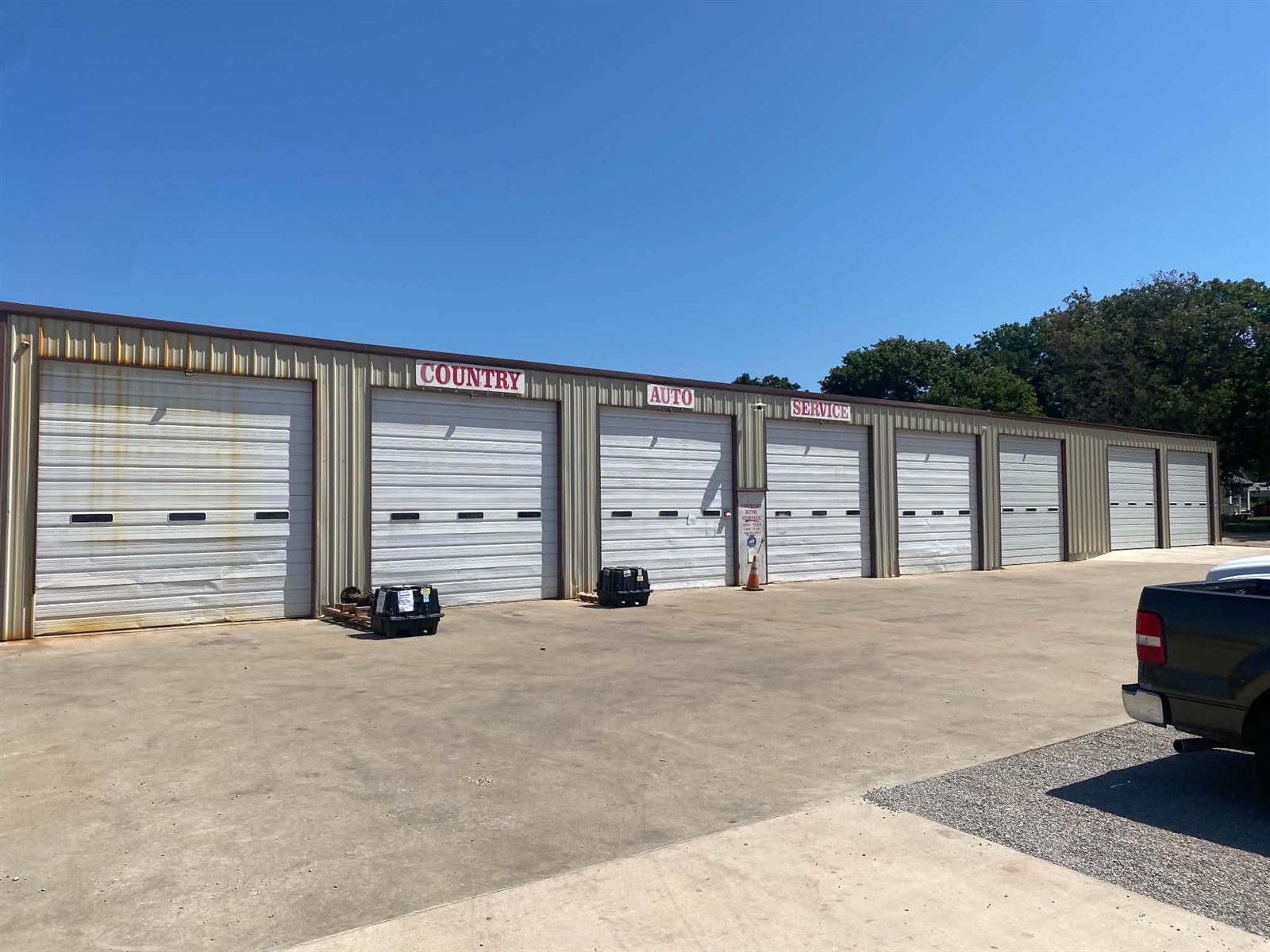 Country Auto Service LLC shop building with eight service bays in McLoud, OK
